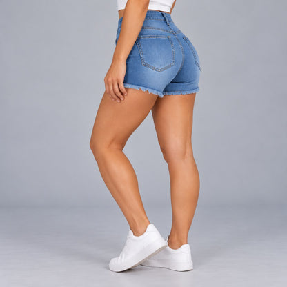 Sculpt Denim Shorts in mid blue, side view walking