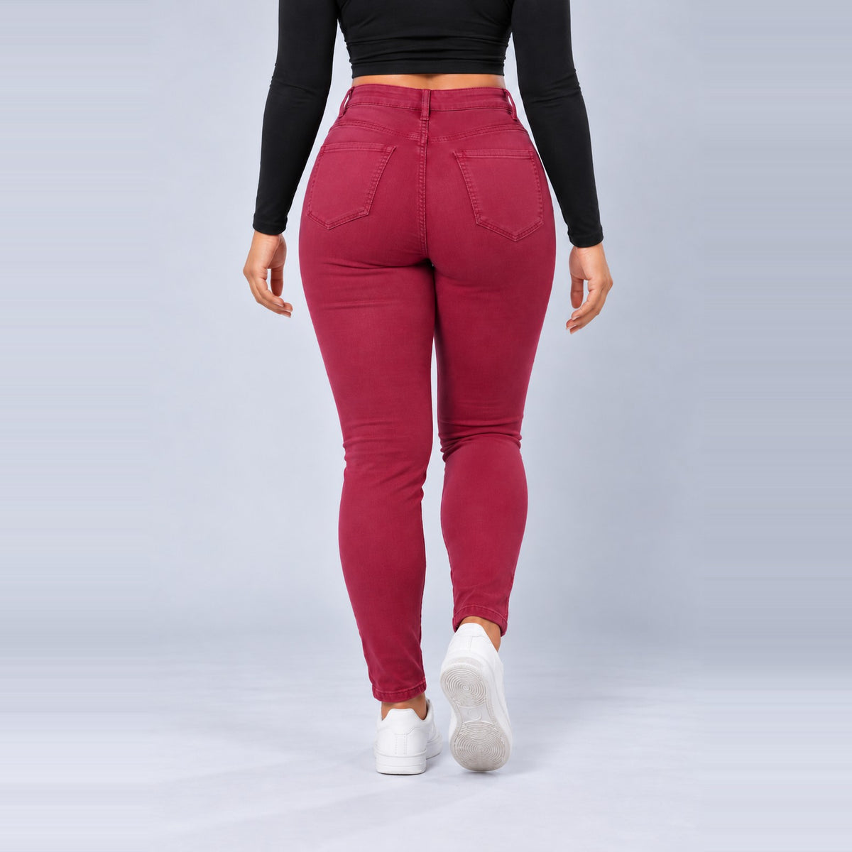 Sculpt Skinny BBL jean in berry, walking back view