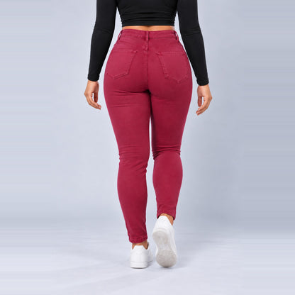 Sculpt Skinny BBL jean in berry, walking back view