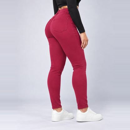 Sculpt Skinny BBL jean in berry, side view, hand on waist