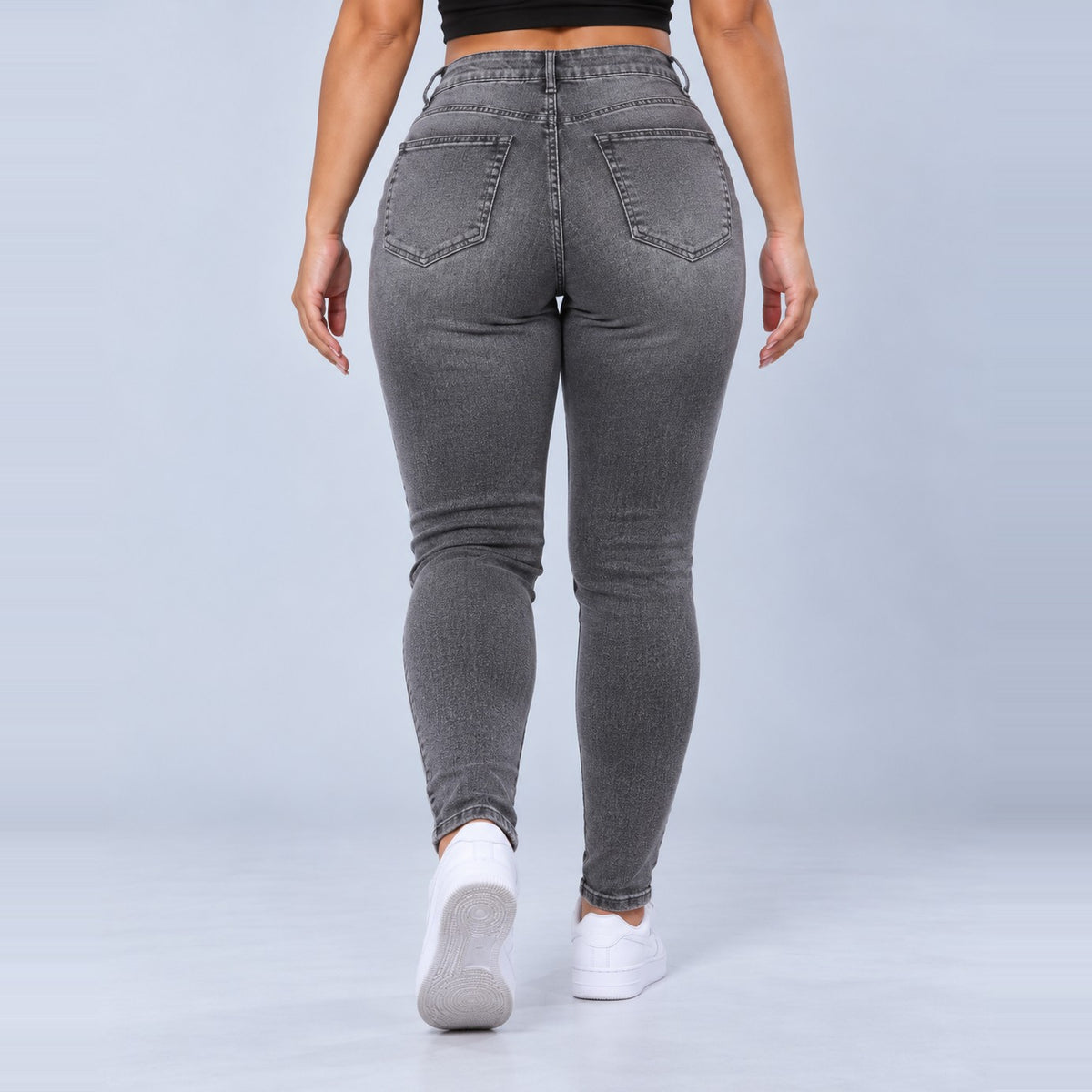 Sculpt Skinny BBL jean in grey, walking back view