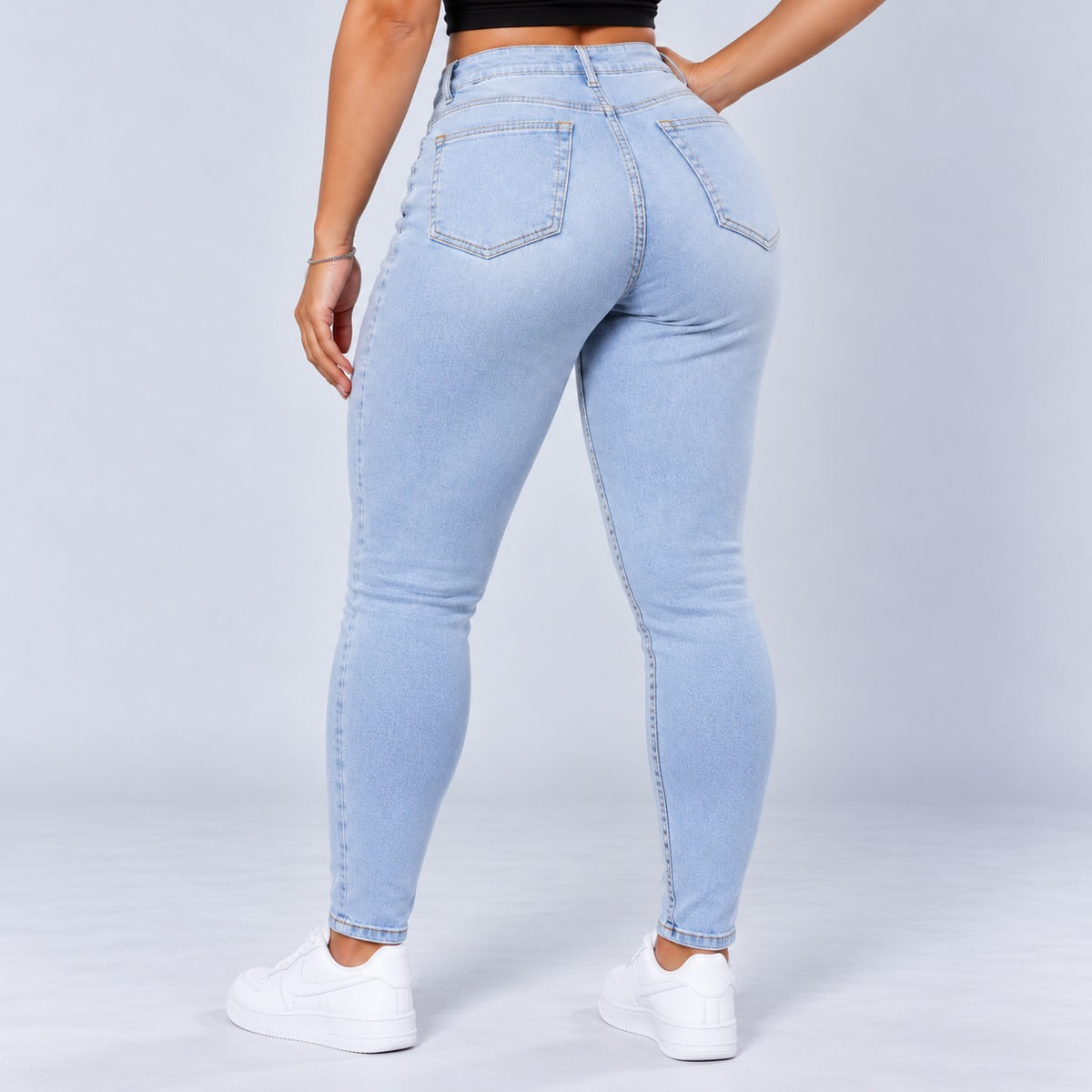 Sculpt Skinny BBL jean in light blue, back view, hand on hip