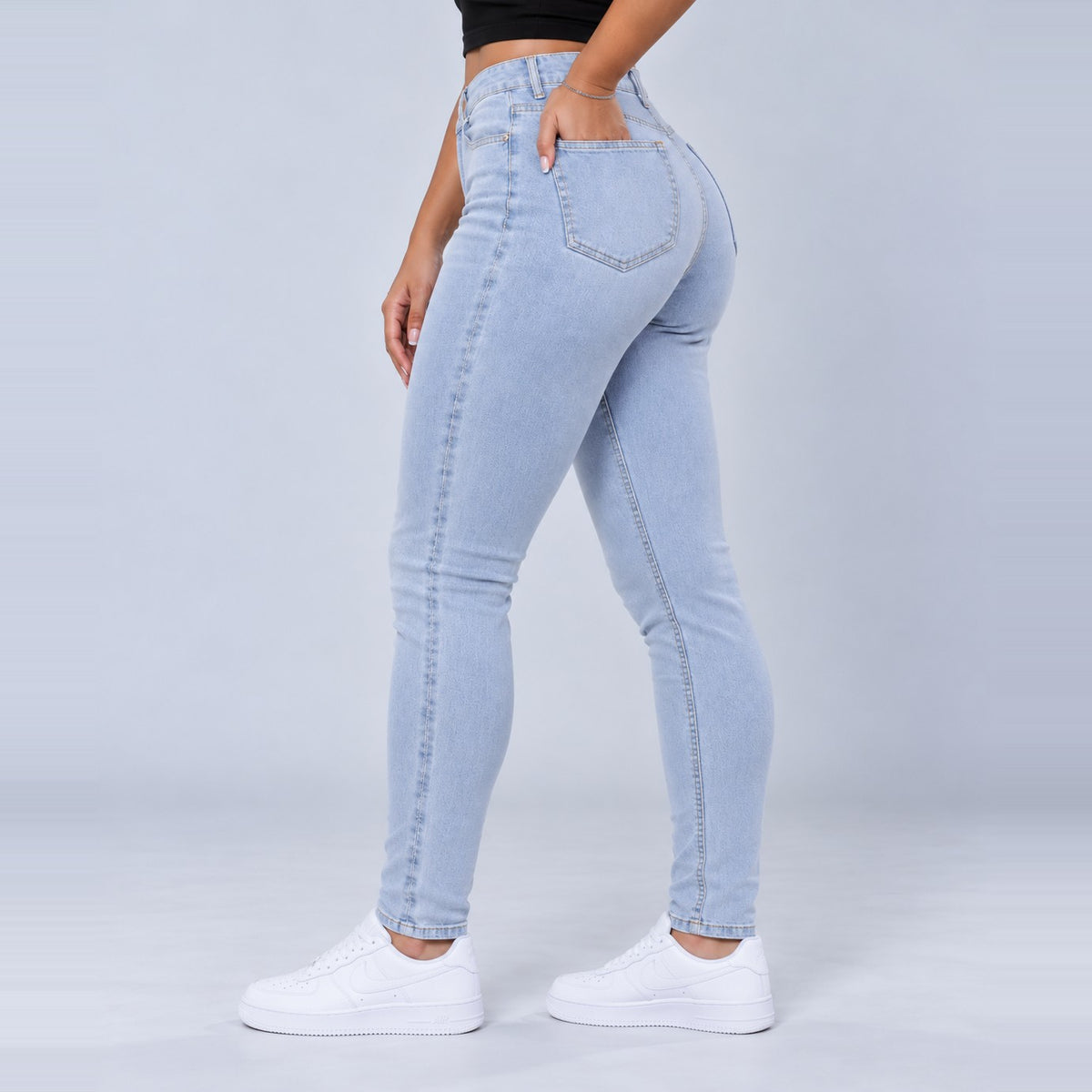Sculpt Skinny BBL jean in light blue, side view, hand in pocket