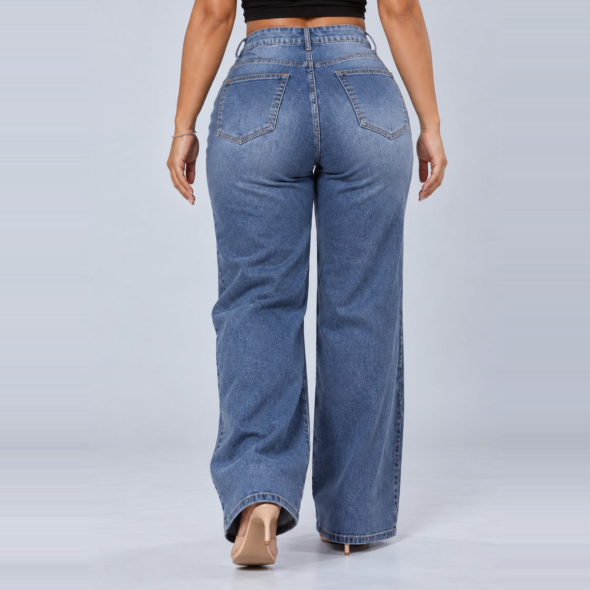 Sculpt Wide Leg BBL jean in mid blue, walking back view